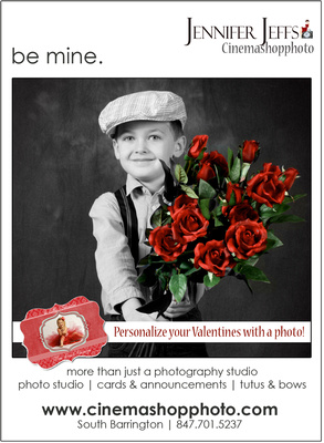 cute boy in newsboy cap holding red roses